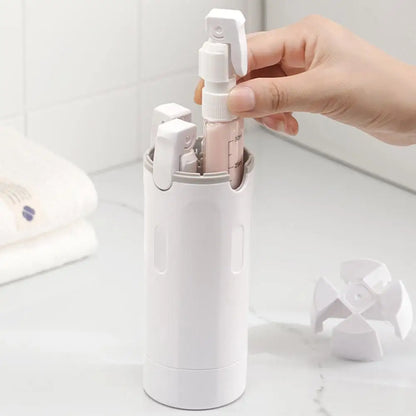 4-in-1 Travel Dispenser Bottle shown next to toiletries it replaces in a travel bag